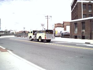 A fire engine crosses at the Grade Crossing, South Broad Street, Trenton.